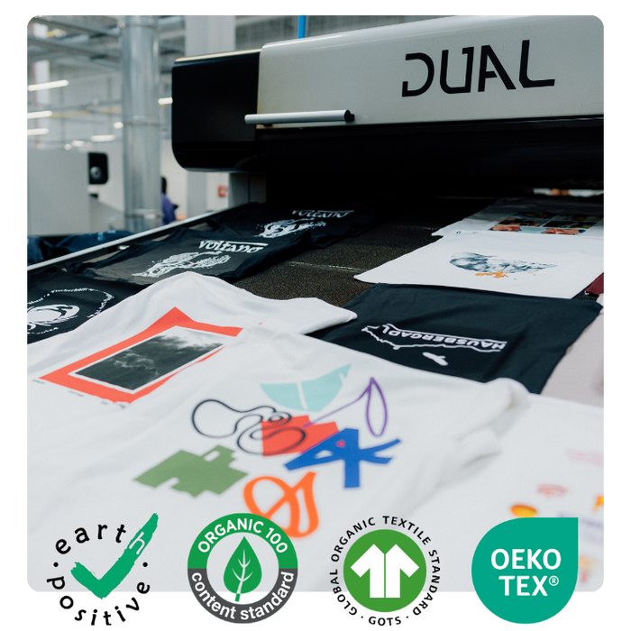 finished printed graphic t-shirts coming off printer during printing process in las vegas